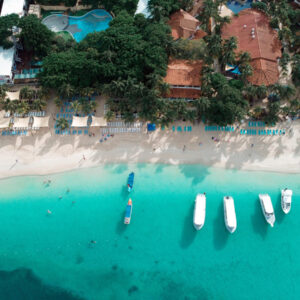 Aerial view of West Bay Beach, Roatán, with boats on turquoise water