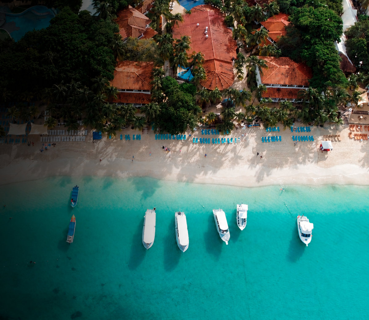 Aerial view of West Bay Beach, Roatán, with boats on turquoise water